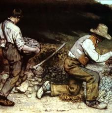 deux hommes cassant des pierres