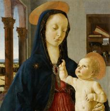 La Vierge, portant sur ses genoux Jésus, qui lui tire la capuche de son scapulaire bleu