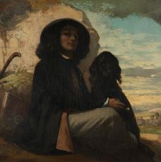 un homme avec un chapeau avec un chien noir