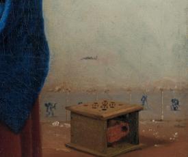 Il s'agit d'une partie du tableau La Laitière, un zoom sur la chaufferette au fond à droite de l'œuvre 