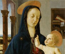 La Vierge, portant sur ses genoux Jésus, qui lui tire la capuche de son scapulaire bleu