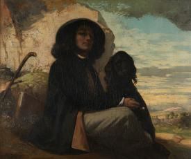 un homme avec un chapeau avec un chien noir