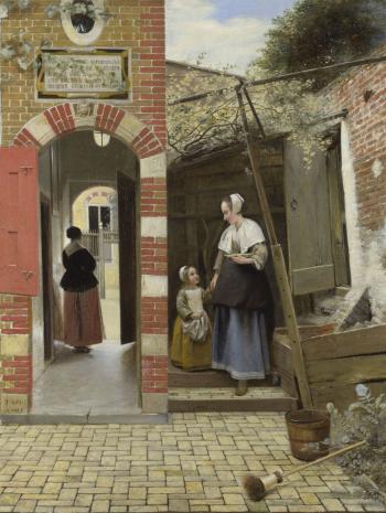 cour d'une maison en briques avec une femme et un enfant