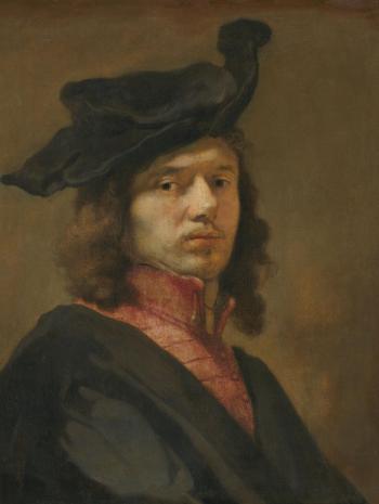 un homme de 3/4 avec un béret