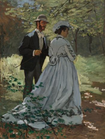 un homme et une femme de dos se promènent